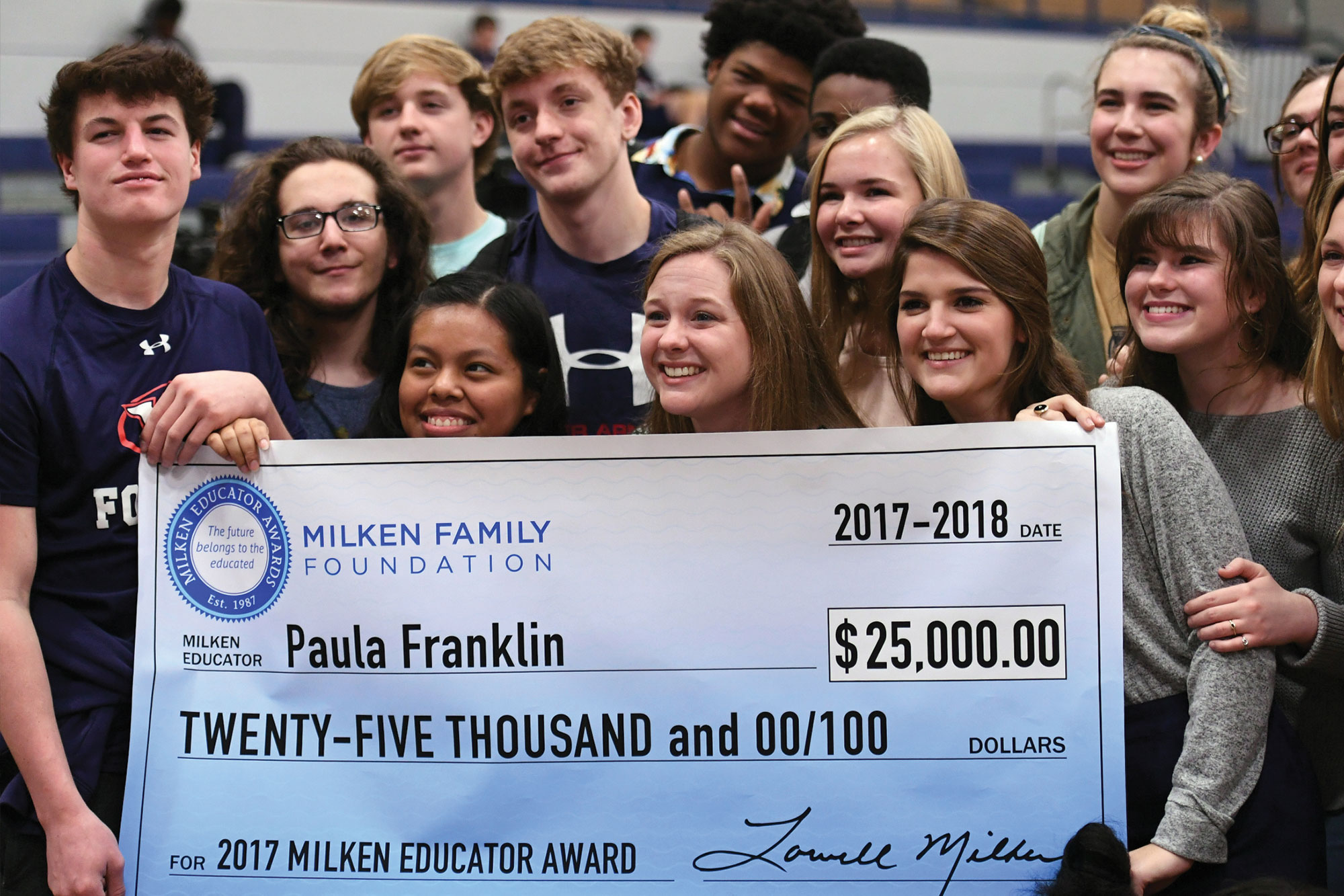 Group of people with giant novelty check