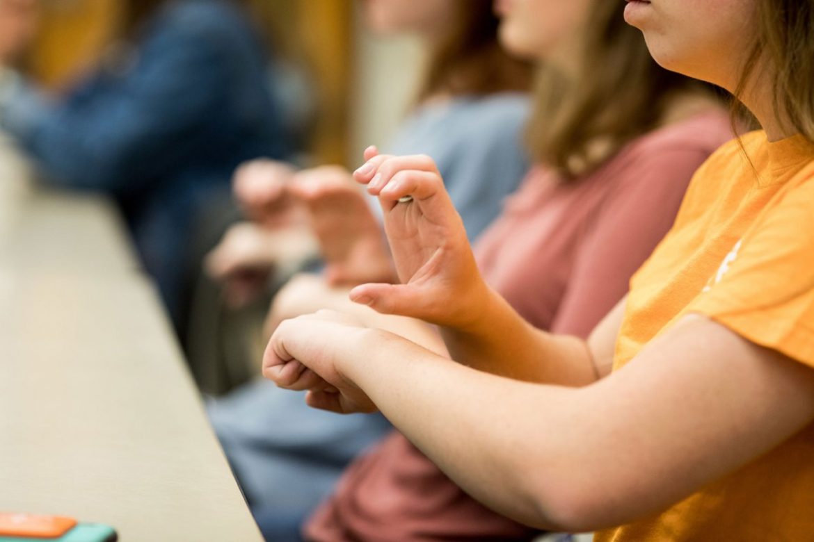 UT Students signing in ASL class